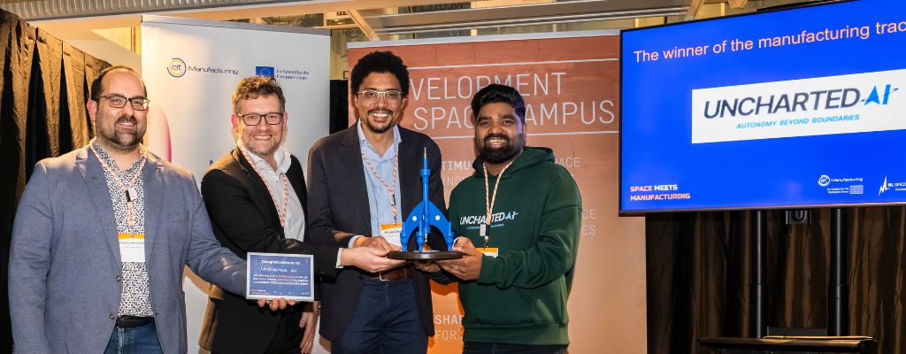 This picture shows the handover of the prize on stage at NL Space Campus in November 2025.